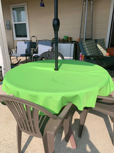 Round Backyard table with Poly Tablecloth and umbrella hole