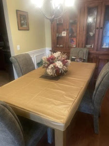 BeAURIFUL VINYL FITTED TABLECLOTH ON A RECTANGULAR TABLE.