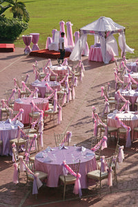 wedding reception with pink bridal satin tablecloths