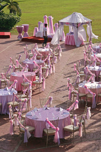 Pink table linens at wedding reception shot from above