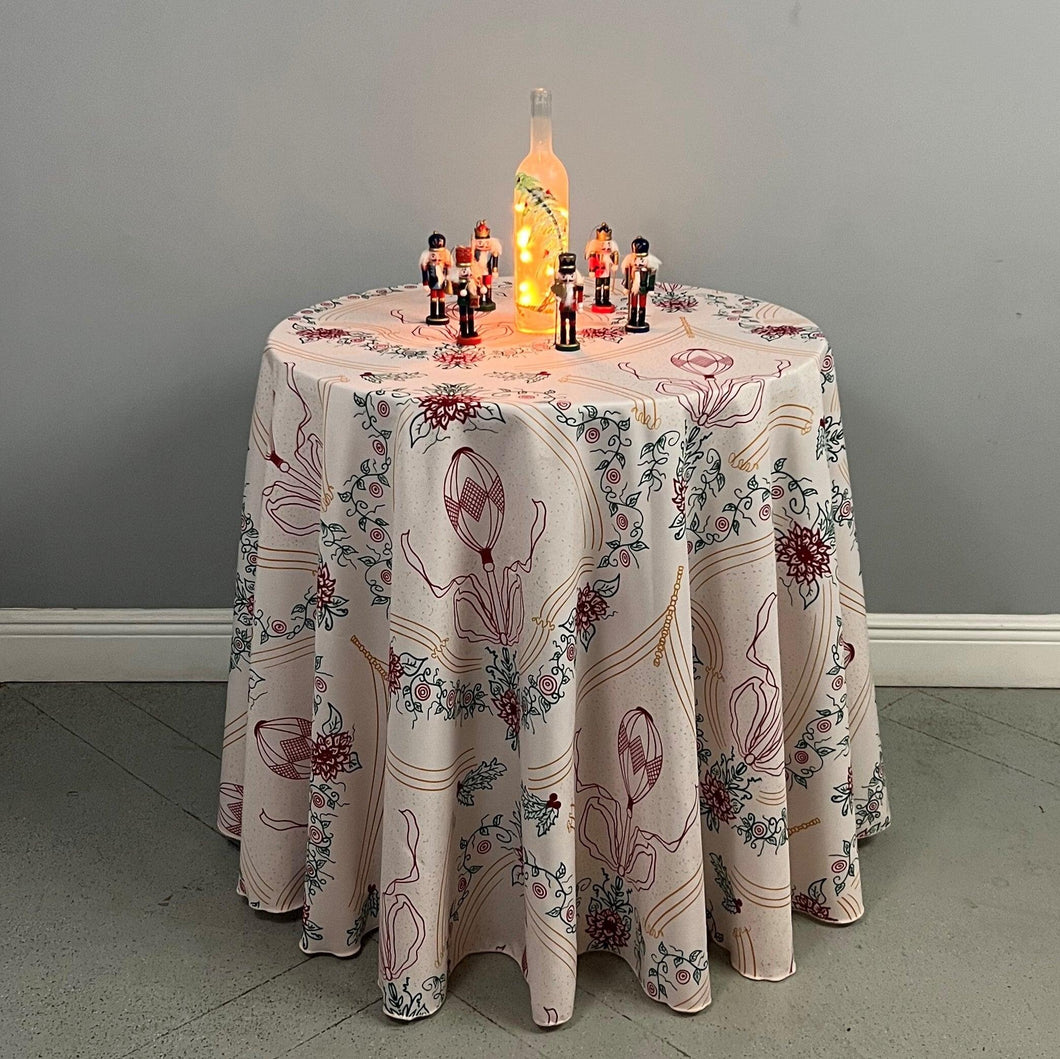 Christmas tablecloth on a round table with holiday decorations 