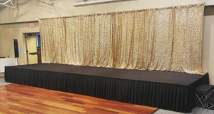 Black book pleat stage skirting on a stage at a school
