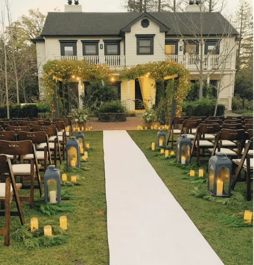 Wedding aisle runner set up at a beaufiul masion, front lawn