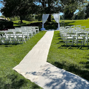 burlap wedding aisle runner at outdoor ceremony
