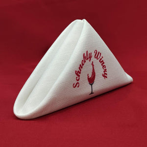 One color custom-printed Panama napkin folded into a standing triangle for Schnebly Winery