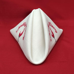 White Panama napkin printed with red Schnebly Winery logo on both sides