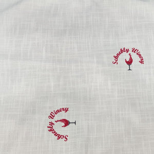 Flat-laying Panama napkin with Schnebly logos printed on specific locations