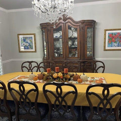 Large fall tablecloth with beautiful harvest decorations and candles