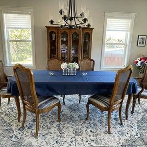 Blue oval table cloth in a dining room