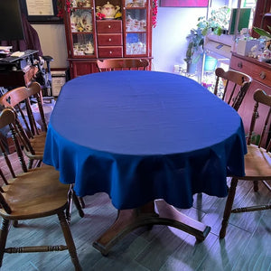 Royal blue oval tablecloth in a farmhouse