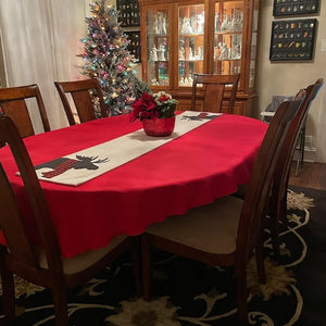 Red oval tablecloth during Christmas