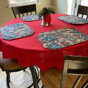 Holiday Red tablecloth on a kitchen table with festive placemats
