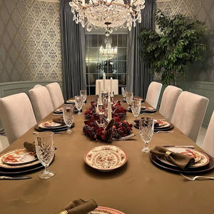 Poly premier table linens on a rectangular table in a fancy home dinner setting