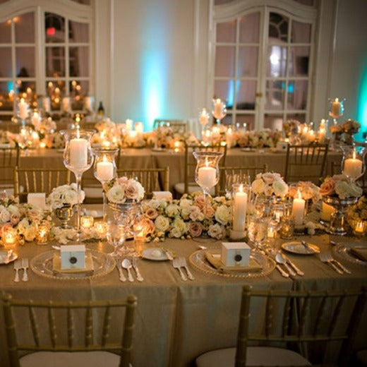 Lavish wedding reception with faux burlap table linens on 2 large table