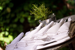 Spun napkins folded with cutlery placed inside