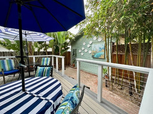 Nautical outdoor tablecloth on a patio at a beach house