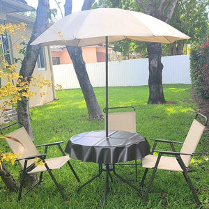 Black vinyl tablecloth outdoor in a yard