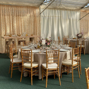 Premium rental Panama Linens on round wedding reception tables