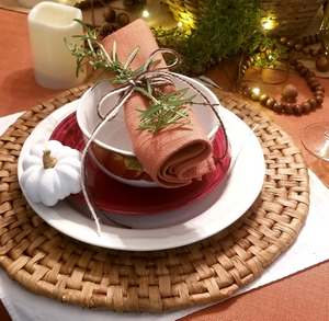 Faux Burlap Panama Napkin rolled on top of bowl on a dinner table