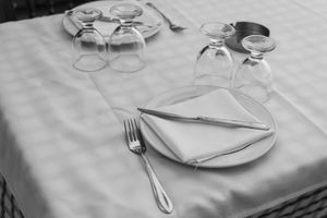 Square folded spun poly napkins with drinking glasses