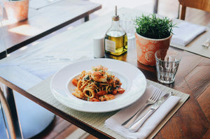 White spun napkin on a restaurant table with food