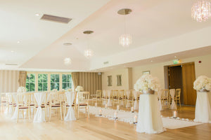 Glamourous wedding reception with a white aisle runner