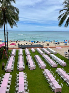 pink tablecloths at beach wedding