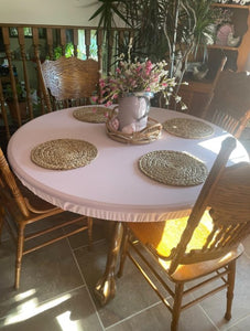 pink vinyl fitted table cover with placemats in a farmhouse