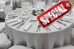 White table cloths with napkins, cutlery and special graphic over it