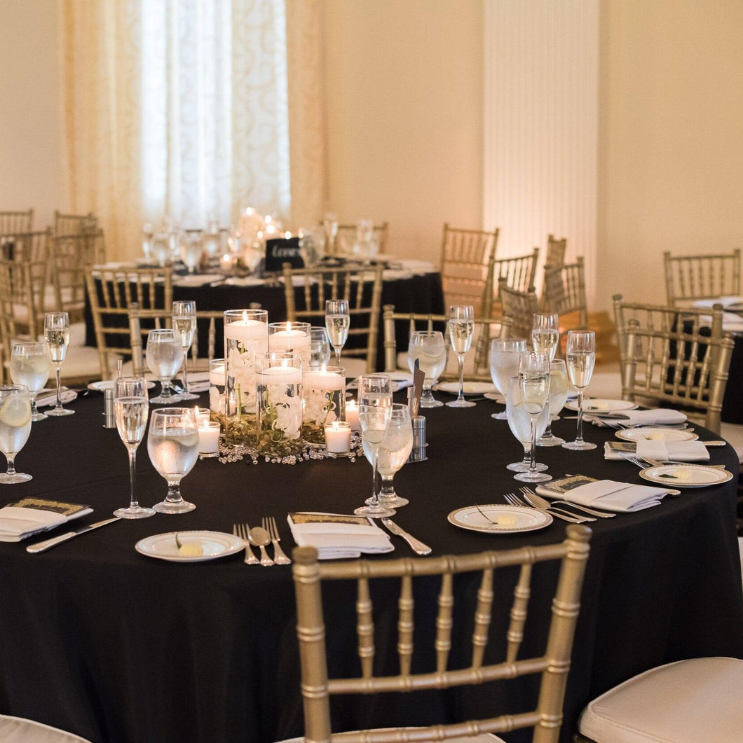 132 Round Tablecloth at a wedding reception with gold banquet chairs