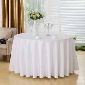 Classy round table linens at home with flowers and candelabra