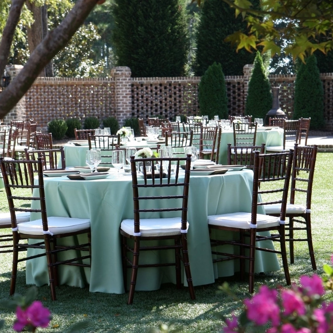 120 Round Tablecloth in Classy outdoor reception setting with white tablecloths