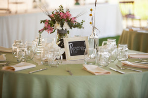 majestic wedding linens at a guest table with a reserved sign