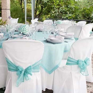 White Poly premier folding chair covers on wedding reception tables