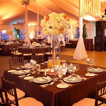 Lavishly set up wedding reception with Duchess satin table linens