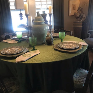 Round velvet tablecloth and napkins on a formal tablescape