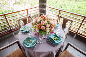 round pink table linen on a balcony