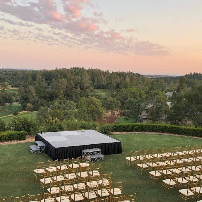 Formal stage skirting at an outdoor wedding