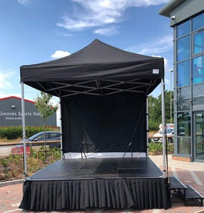 stage skirt under a tent