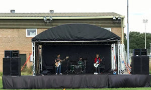 black stage skirt flat wrap at an outdoor performance