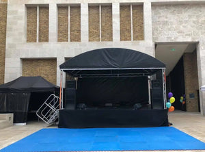 black stage skirt at a special event outdoors