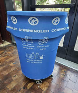 Blue custom-printed compost trash can cover in a school cafeteria setting