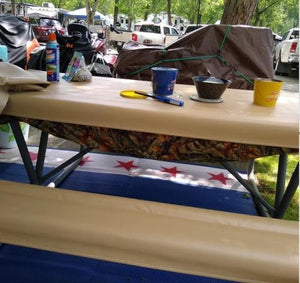 Vinyl fitted tablecloth on a picnic table and bench