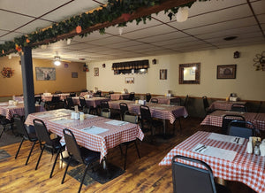 white and red checkered vinyl tablecloths in an event room