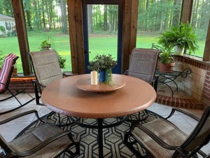 Round vinyl fitted tablecloth on a patio