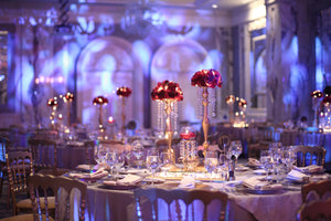Luxurious wedding with poly premier table linens featuring flowers and crystal centerpieces