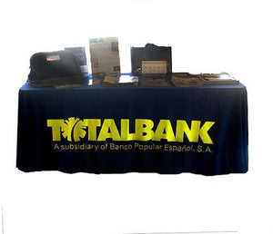 4-foot printed table cover for Total Bank with printed material on top