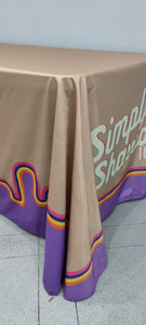 Corner of a 6 foot table with full-color branded tablecloth