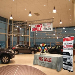  Custom Printed table throw for Car dealership with prize wheel sitting on top of table