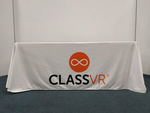 White trade show tablecloth with logo for ClassVr printed in orange and black
